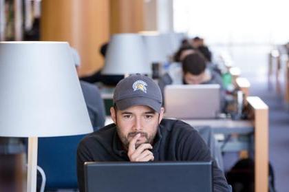 Student looking at computer intently