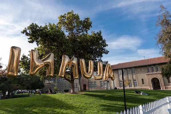 color image of gold balloons spelling the word 'alumni'
