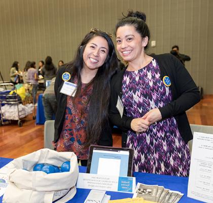 Chicanx/Latinx Students at event table