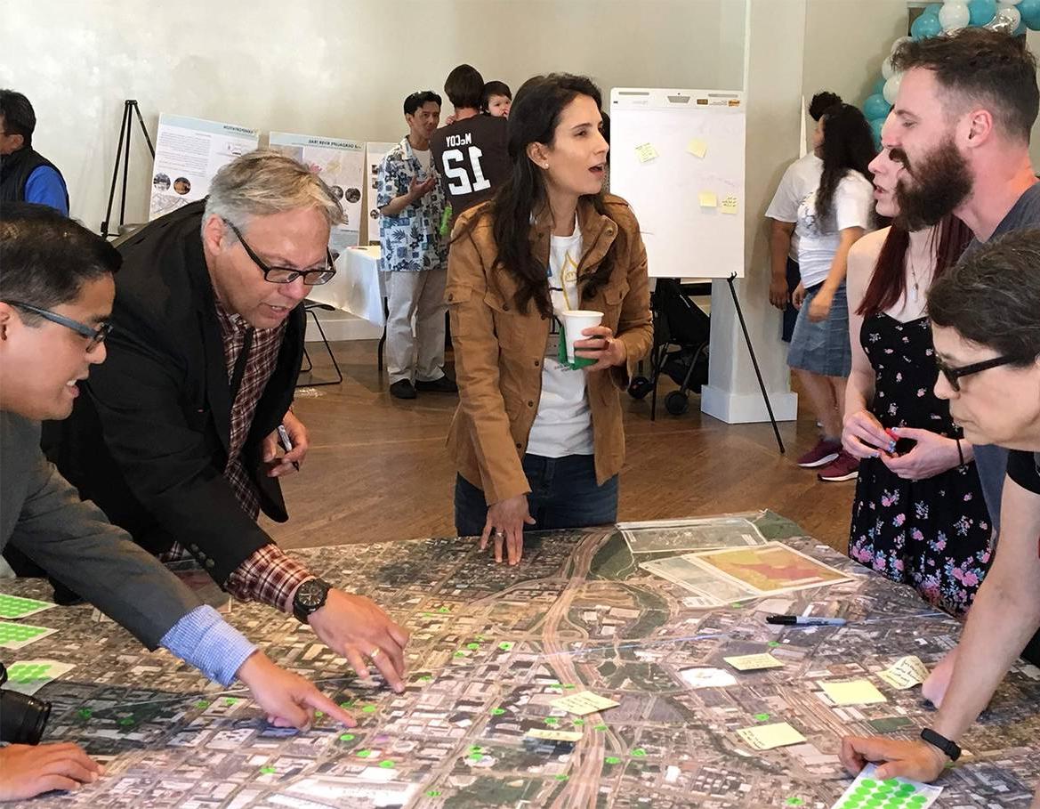 Students and community members review plans